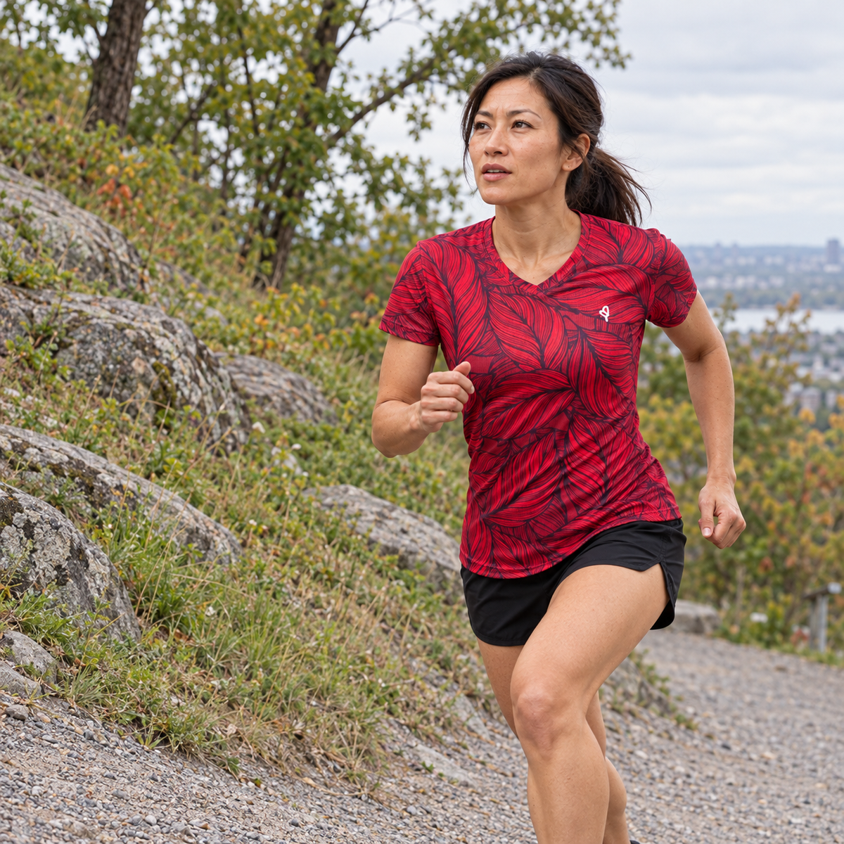 YUL Crimson Red women's running shirt, red and black, worn while running.