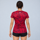 YUL Crimson Red women's running shirt, red and black, back studio view.