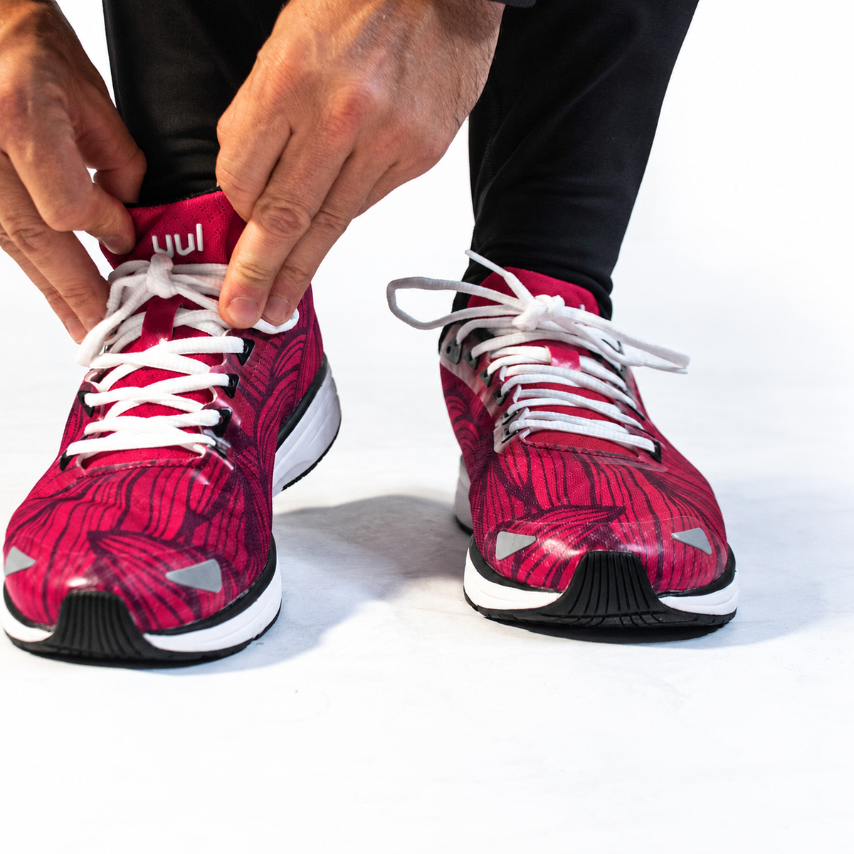 YUL Crimson Red road shoes, top view while tying the laces.